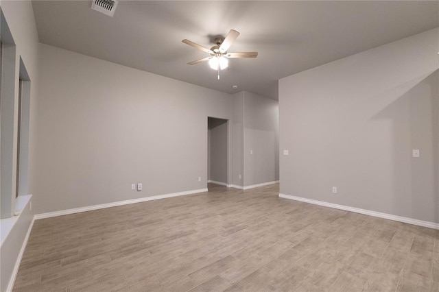 12333 SW 30th St, Yukon, OK 73099 - empty room with a ceiling fan, light wood-style floors, and baseboards