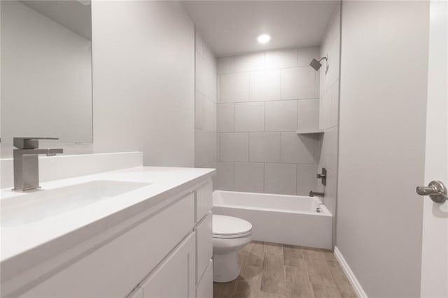 12333 SW 30th St, Yukon, OK 73099 - bathroom with wood finished floors, toilet, vanity, shower / bathtub combination, and recessed lighting