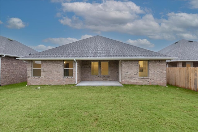 12333 SW 30th St, Yukon, OK 73099 - rear view of house with roof with shingles, a patio, and brick siding