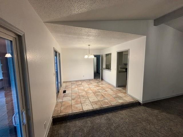 hall featuring a textured ceiling, lofted ceiling with beams, light colored carpet, and an inviting chandelier