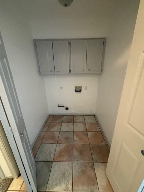 laundry room with cabinets, washer hookup, and light tile patterned floors