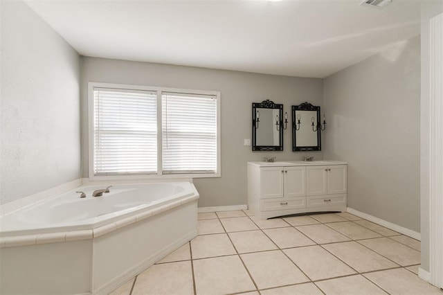 bathroom featuring a bath, vanity, and tile patterned floors