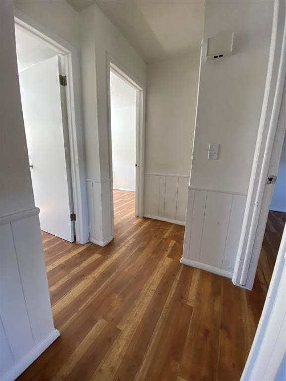 corridor with dark hardwood / wood-style floors