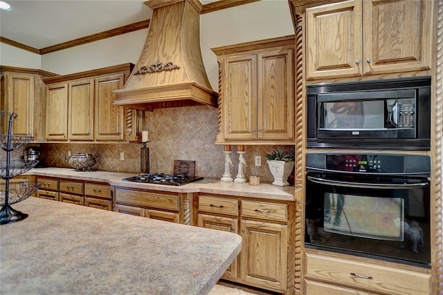 kitchen with premium range hood, crown molding, tasteful backsplash, and black appliances