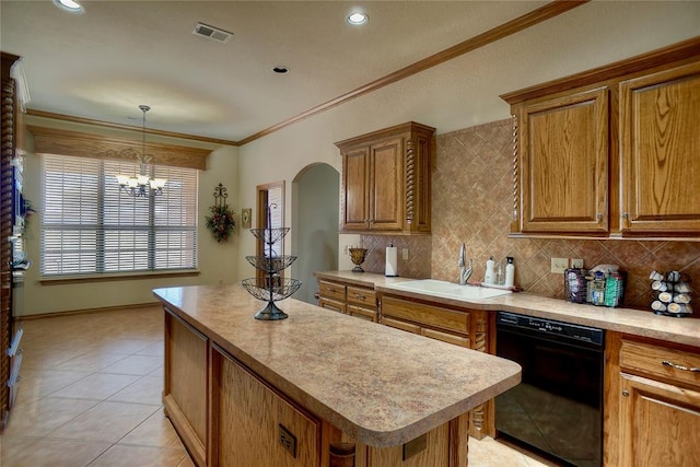 kitchen with crown molding, sink, dishwasher, a chandelier, and a kitchen island