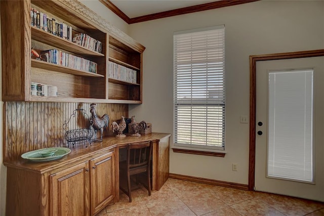 office space featuring crown molding and light tile patterned flooring