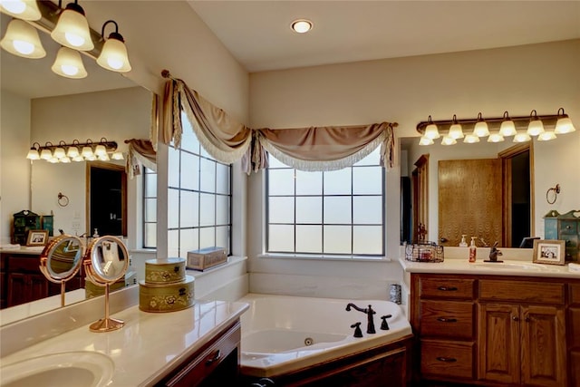 bathroom featuring vanity and a tub