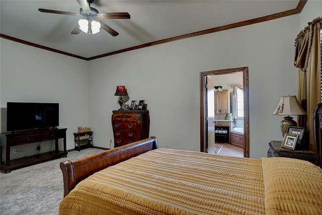 bedroom with ceiling fan, ensuite bathroom, light colored carpet, and ornamental molding