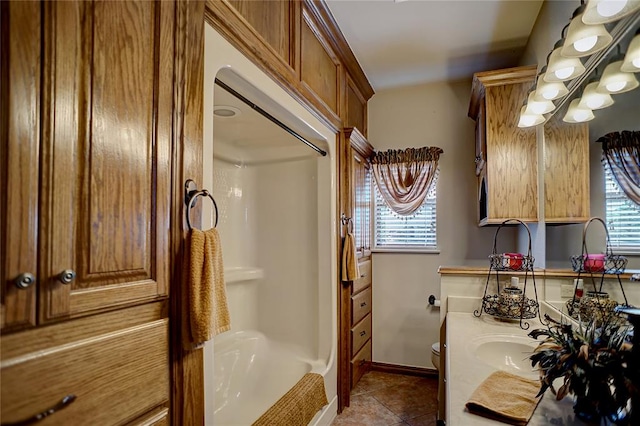 bathroom with walk in shower, tile patterned flooring, vanity, and toilet