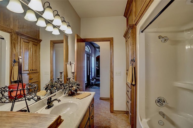 bathroom with tile patterned floors, vanity, and bathing tub / shower combination