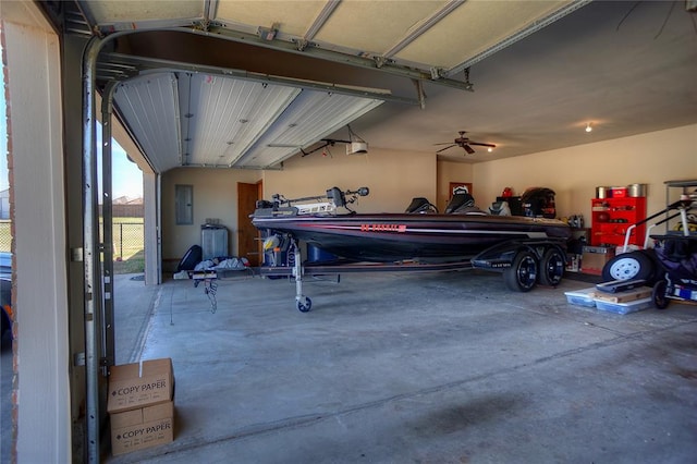 garage featuring electric panel and ceiling fan