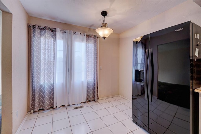 empty room with light tile patterned flooring