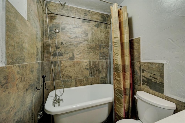 bathroom featuring shower / bath combo and toilet