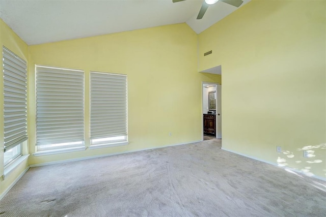 unfurnished room with light carpet, ceiling fan, and lofted ceiling