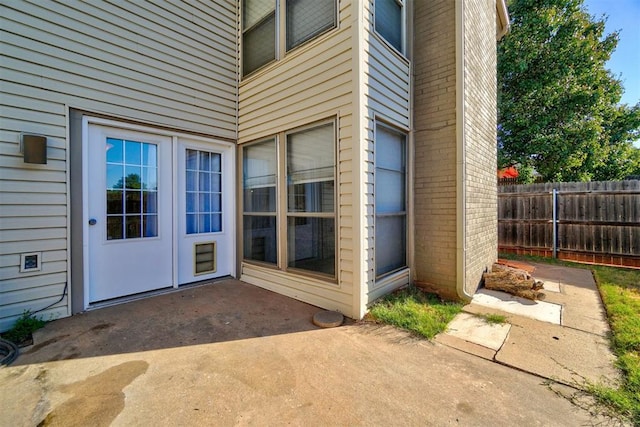 entrance to property with a patio area