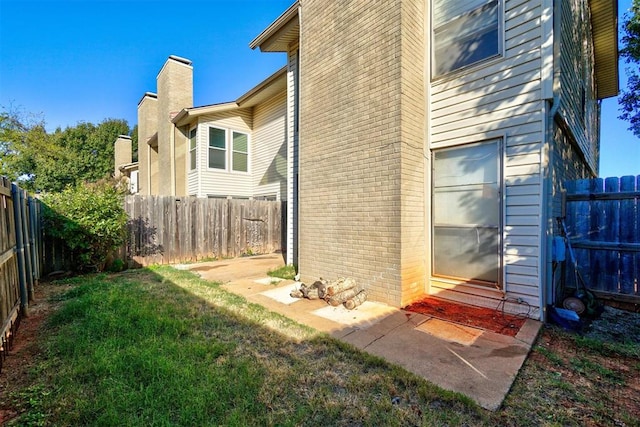 view of property exterior with a lawn