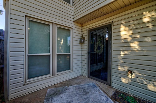 doorway to property featuring a patio area