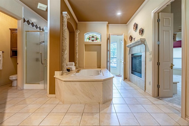 bathroom with ornamental molding, tile patterned flooring, a stall shower, and toilet