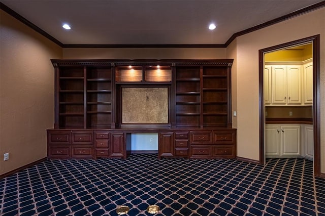 unfurnished office featuring dark colored carpet, recessed lighting, ornamental molding, built in study area, and baseboards