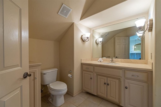 bathroom featuring visible vents, toilet, vaulted ceiling, vanity, and tile patterned floors