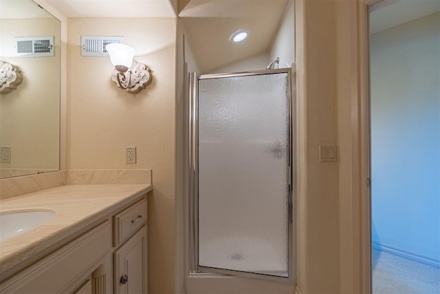 bathroom featuring vanity, a shower stall, visible vents, and recessed lighting