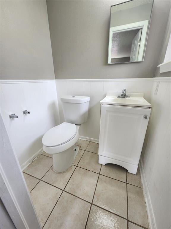 5300 Creekwood Ter, Oklahoma City, OK 73135 - bathroom with vanity, wainscoting, and tile patterned flooring