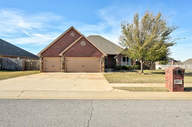 view of front facade with a front lawn and a garage