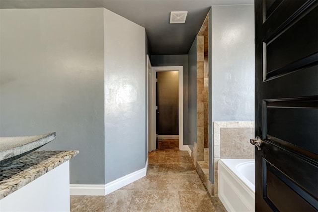 bathroom featuring shower with separate bathtub