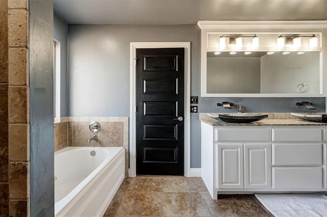 bathroom with vanity and a bathtub