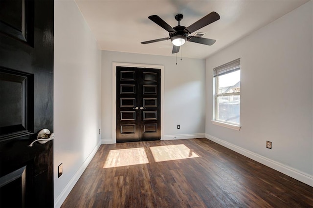 entrance foyer featuring dark hardwood / wood-style floors and ceiling fan