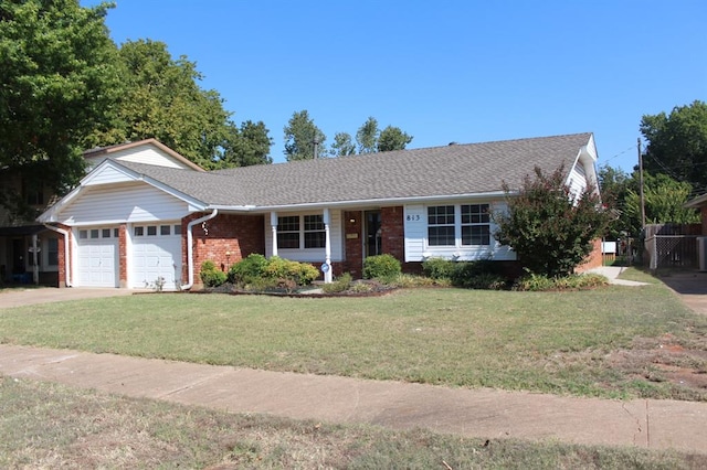 single story home with a front yard and a garage