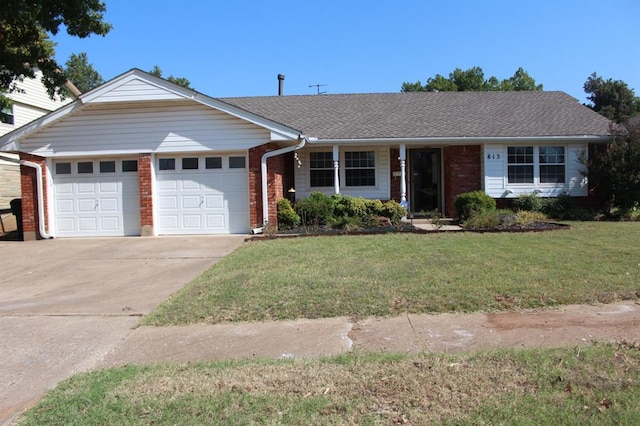 single story home featuring a front yard and a garage