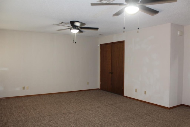 empty room with carpet flooring and ceiling fan