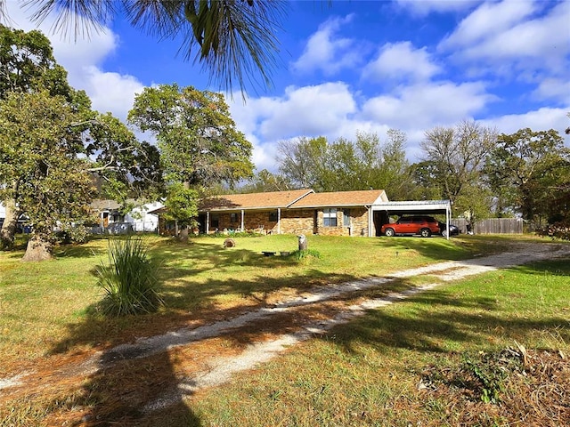 view of front of house featuring a front lawn and a carport