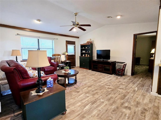 living room with hardwood / wood-style floors, ceiling fan, ornamental molding, and vaulted ceiling