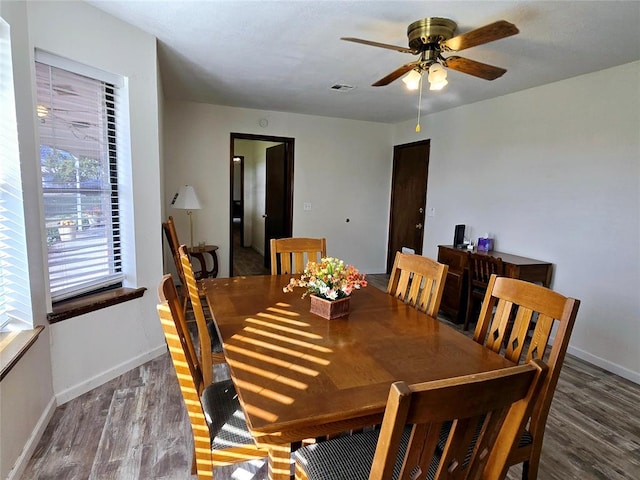 dining area featuring ceiling fan and wood-type flooring