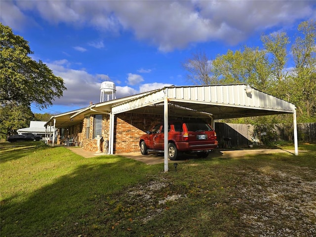 view of parking featuring a yard and a carport