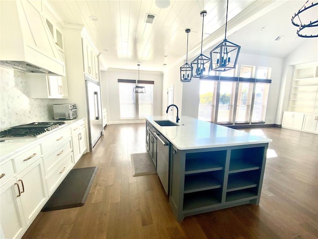 kitchen featuring white cabinetry, a kitchen island with sink, plenty of natural light, and custom range hood