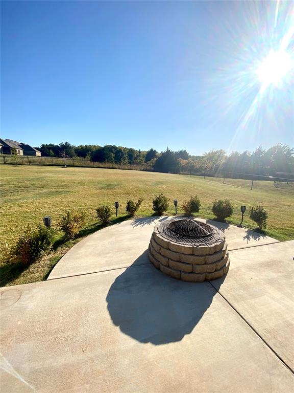 view of patio / terrace with a rural view and an outdoor fire pit