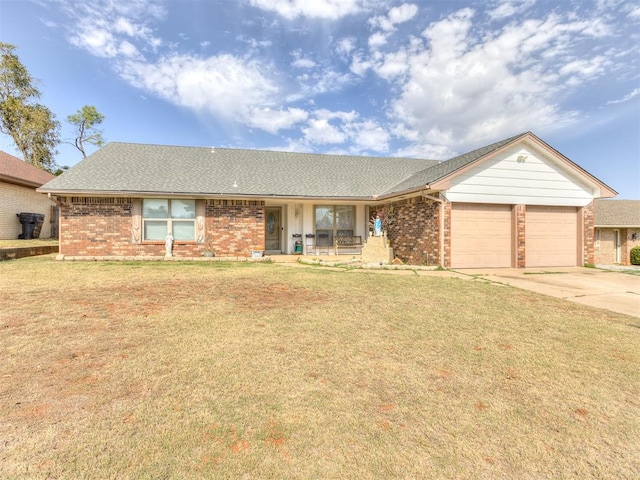 ranch-style home featuring a front yard and a garage