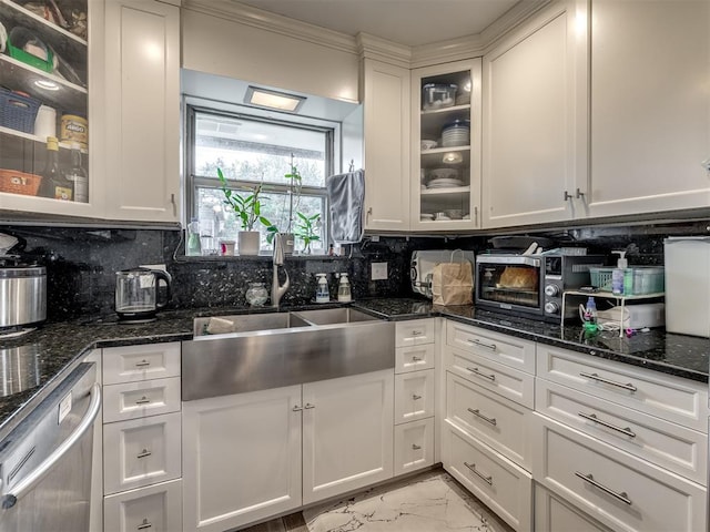 kitchen featuring dishwasher, white cabinets, tasteful backsplash, and dark stone countertops