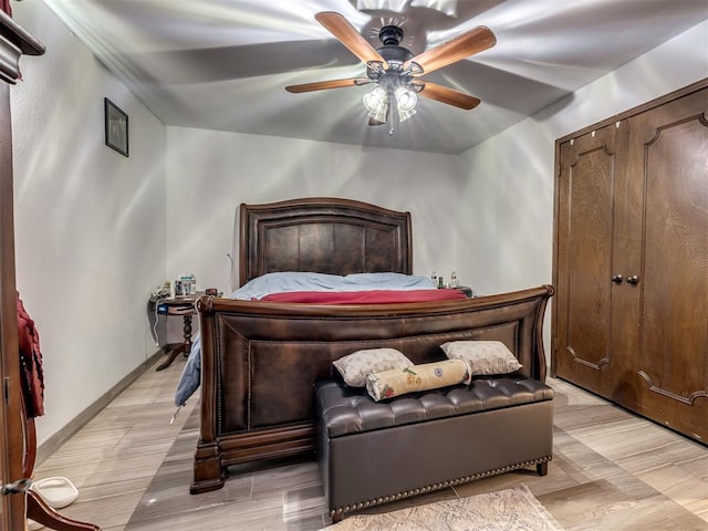 bedroom featuring light hardwood / wood-style flooring and ceiling fan