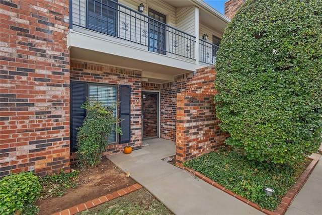 entrance to property with a balcony