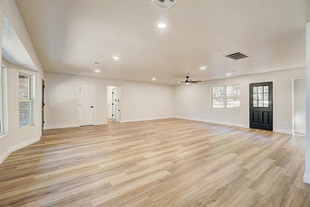 interior space with light hardwood / wood-style floors and ceiling fan