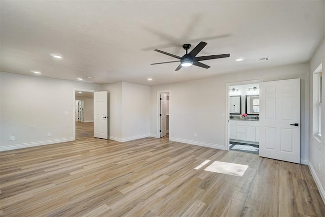 unfurnished living room featuring ceiling fan and light wood-type flooring