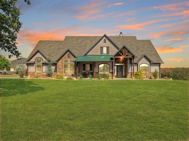 craftsman inspired home featuring a yard