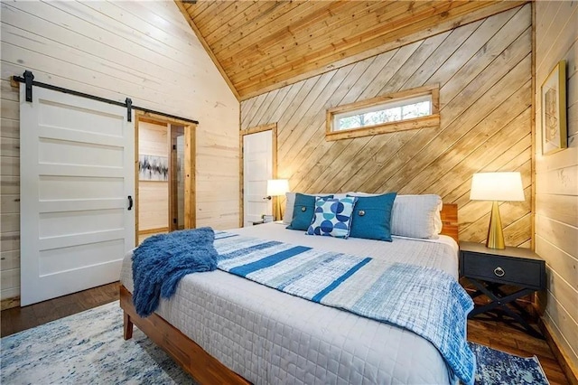 bedroom featuring wood walls, a barn door, wood ceiling, and dark wood-type flooring