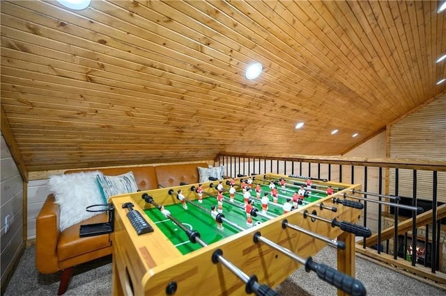 playroom with wooden walls, wood ceiling, vaulted ceiling, and dark colored carpet