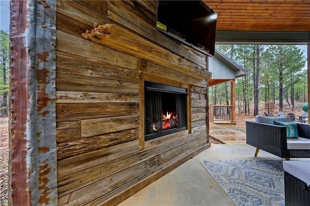 exterior space with exterior fireplace