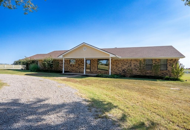 ranch-style house with a front yard